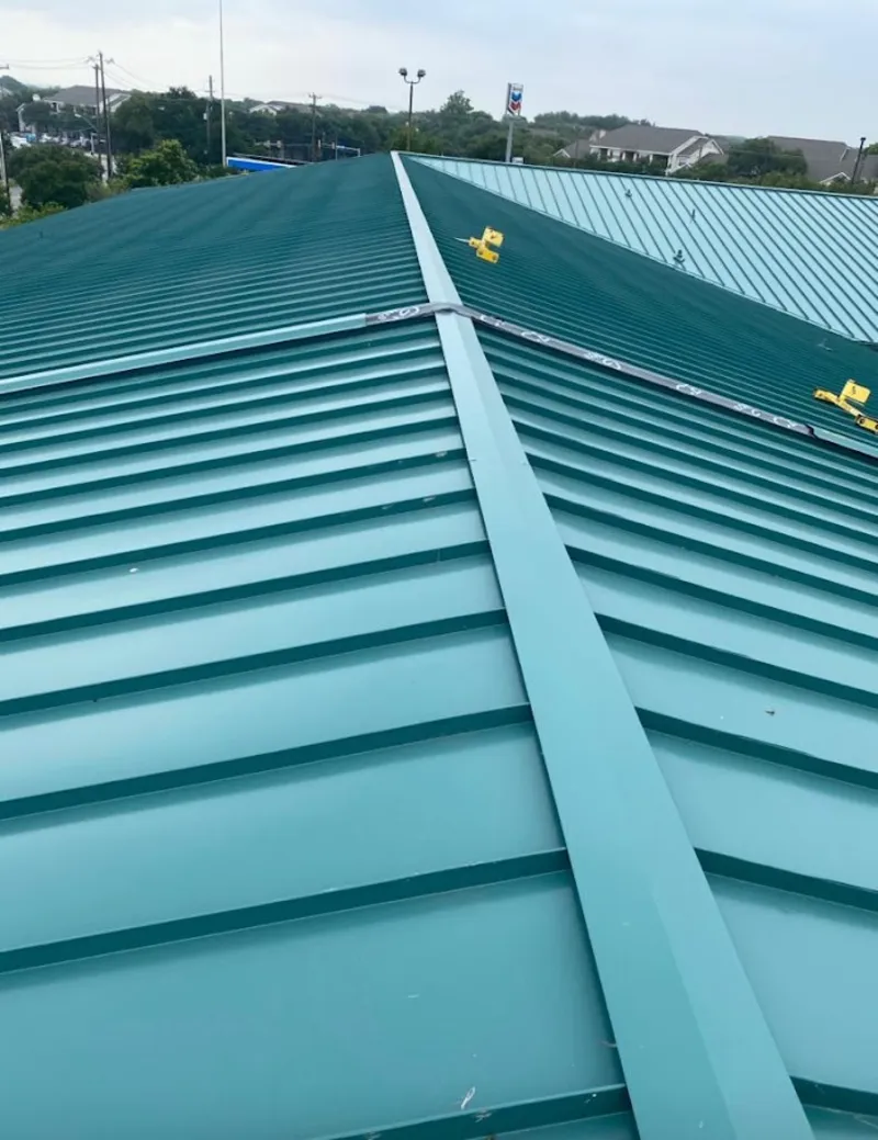 Green commercial metal roof ridge and valley for Metal Roof Repair in West Pensacola